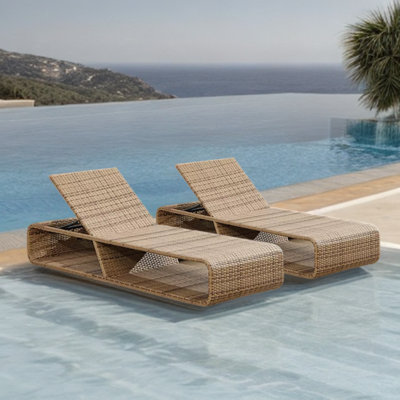 Outdoor pool loungers Beach chairs by the sea