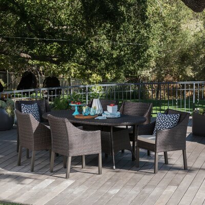 Arant Oval 6 - Person 69" Long Dining Set with Cushions