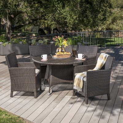 Basabi Round 4 - Person 46.5" Long Dining Set with Cushions