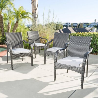 Deanna Outdoor Stacking Dining Armchairs with Cushions by Latitude Run