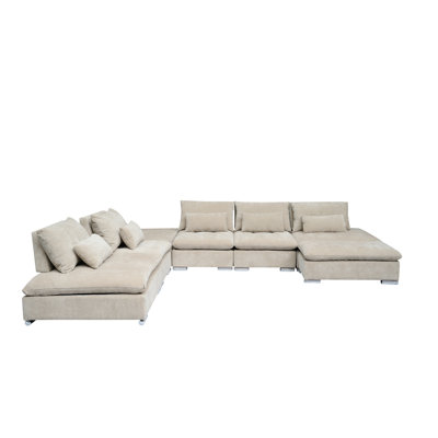 Baseler 141.5" Wide Reversible Corner Sectional with Ottoman by Wade Logan