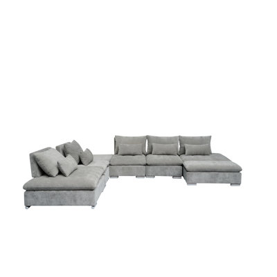 Baseler 141.5" Wide Reversible Corner Sectional with Ottoman by Wade Logan