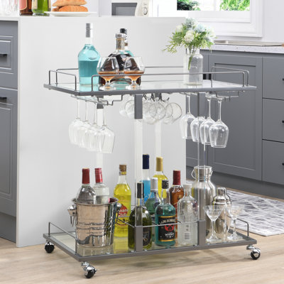 Kibwe Metal & Acrylic Bar Cart with Glass Shelves and Stemware Rack by Rebrilliant
