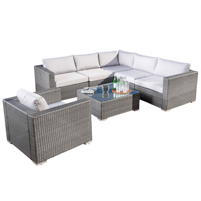 Minisci 7 Piece Rattan Sectional Seating Group with Cushions