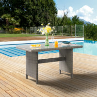 ASTI 55" Wide 30" Height All-Weather Wicker Outdoor Cocktail Table With Glass Top by Bayou Breeze