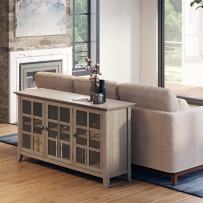 Acadian 62"W Solid Wood Transitional Storage Cabinet with Glass Doors and Adjustable Shelves by Simpli Home