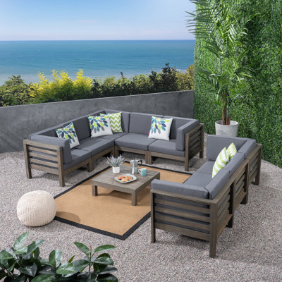 Ajanai Outdoor 9 Piece Sectional Seating Group with Cushions by Wade Logan