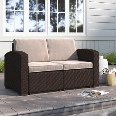 Alderman Faux Rattan Loveseat with All-Weather Cushions by Beachcrest Home