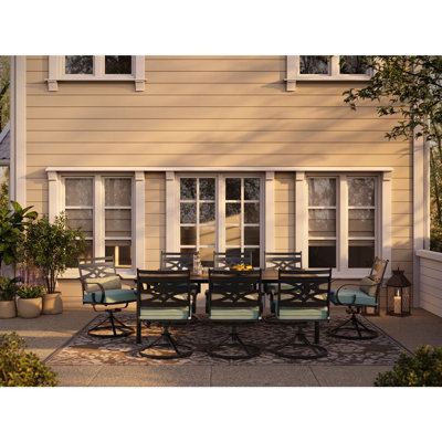 Canora Grey Elmfield 9-Piece Dining Set In Navy Blue With 8 Swivel Rockers And A 42-In. X 84-In. Table, 4CCC15D086C845389DEC1A7B4D66593E