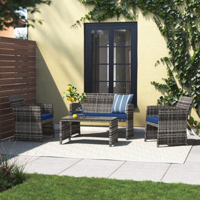 Akshath 4pcs Patio Rattan Furniture Conversation Set With Glass Table Top And Cushions