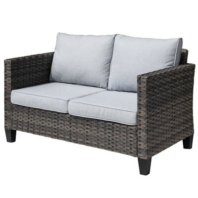 Lovall Wicker/Rattan Outdoor Loveseat With Cushions by Ebern Designs