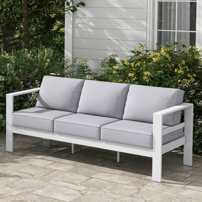 Arnhildur Bolanle 76" Wide Outdoor Patio Sofa with Cushions by Wade Logan