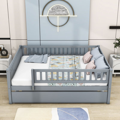 Havva Wood Daybed with Twin Size Trundle and Fence Guardrails by Harriet Bee
