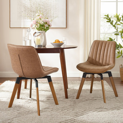 Bishaan Tufted Faux Leather Upholstered Swivel Dining Side Chair by Wade Logan