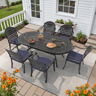 7-Piece 81.89 " L 41.34 " W Oval Table Cast Aluminum Outdoor Dining Set with Umbrella Hole and Blue Cushions