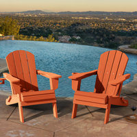 Ergonomically designed resin folding Adirondack chair by Highland Dunes