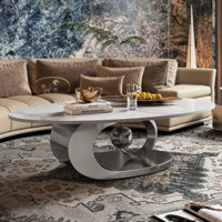 Fantastic Luxurious Oval Faux Marble Coffee Table With Midsize Sphere Crescent-Shaped Base by Everly Quinn
