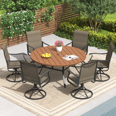 6-Person Patio dining set with 56" Faux Wood Plastic Dining Table and Textilene Swivel Dining Chair by Canora Grey