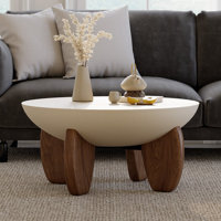 Curva Round Coffee Table With Wood Legs by Orren Ellis