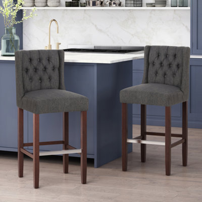 Upholstered Dining Chairs with button tufted back by Hokku Designs