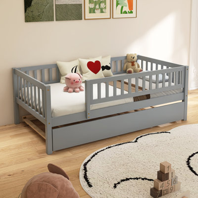 Wood Daybed With Trundle And Fence Guardrails by Harriet Bee
