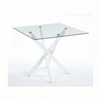 Kaison Dining Table with Tempered Glass Top & Cross Metal Legs by Wrought Studio