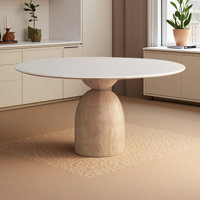 White round stone slab dining table by George Oliver