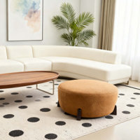 Modish Round Ottoman: Boucle Top With Splayed Rubber Wood Legs, Pumpkin Orange by Wrought Studio