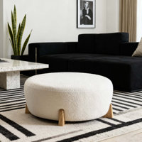 Modish Round Ottoman: Boucle Top With Splayed Rubber Wood Legs, Pumpkin Orange